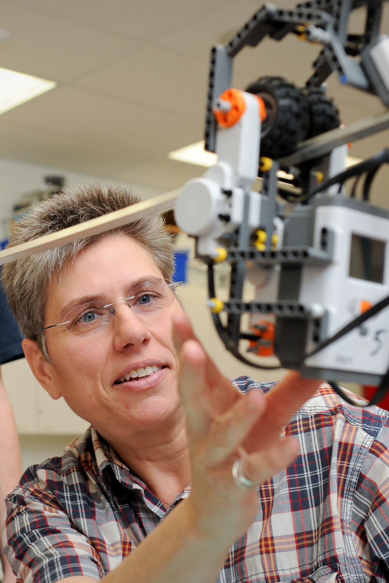 Terri Varnado adjusts equipment.